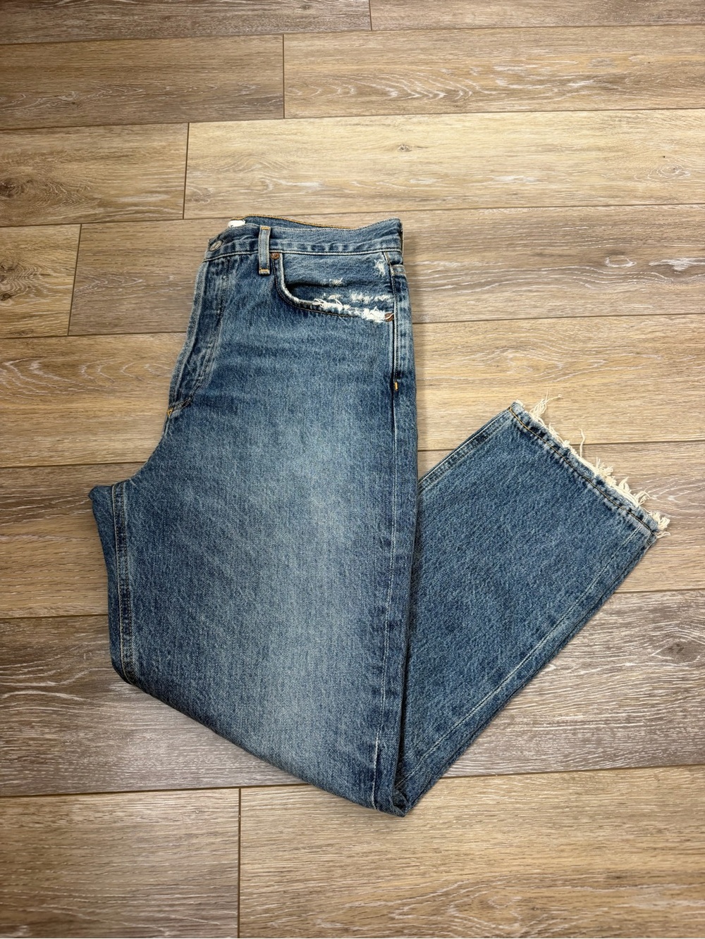Agolde Distressed Light Blue Boyfriend Jeans with Frayed Hem
